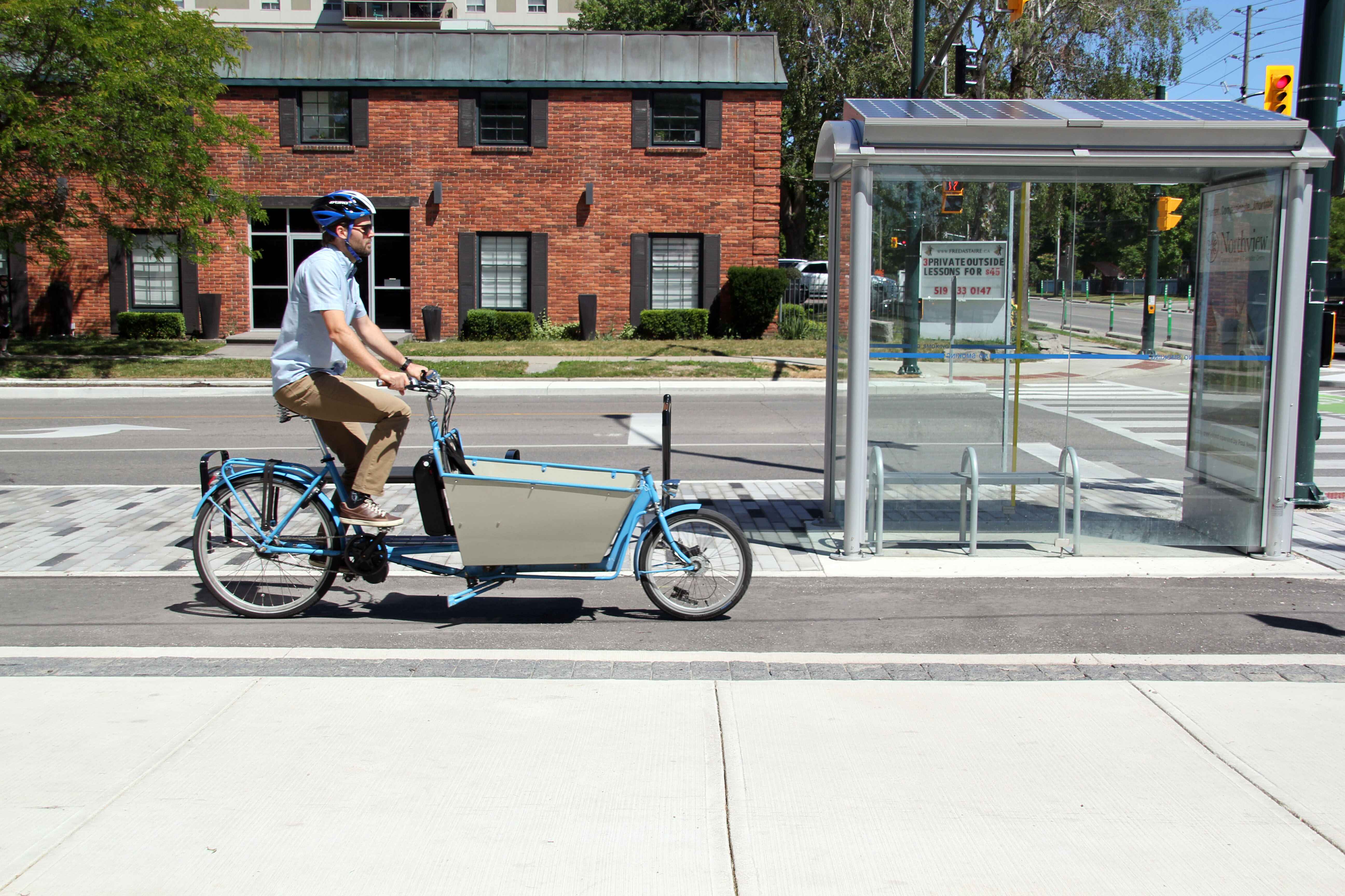 A man rides a bike in the new Dundas Cycle Track downtown. 