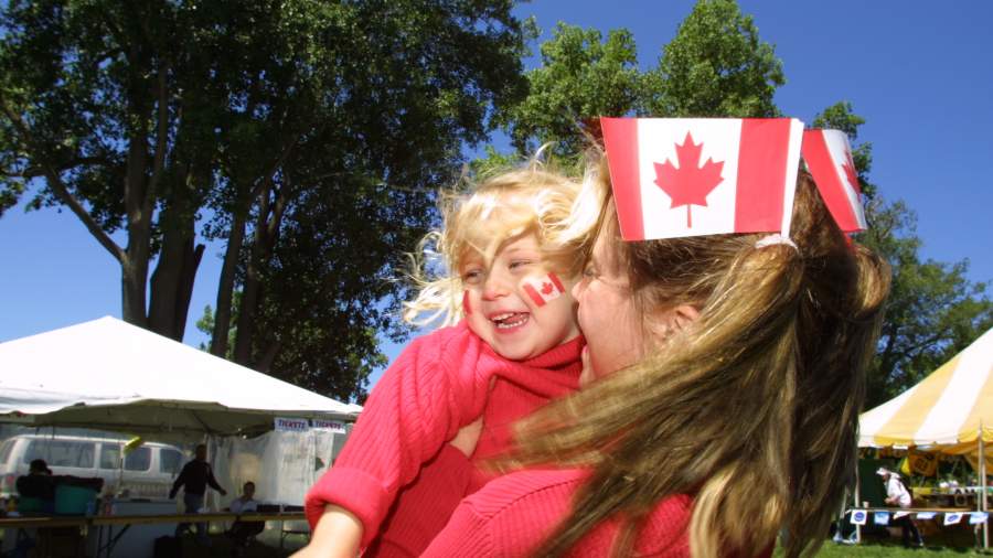 Woman and small child with Canada flags