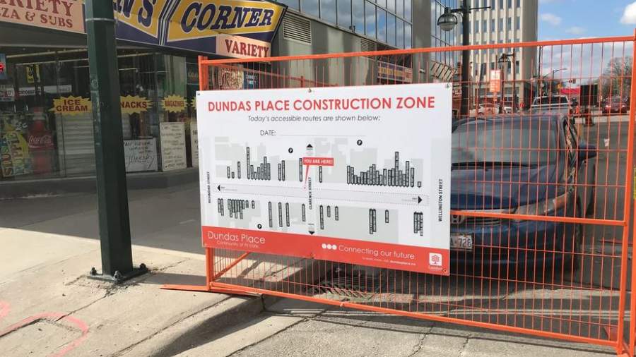 A sign on the construction fencing showing the Dundas Place construction site. 