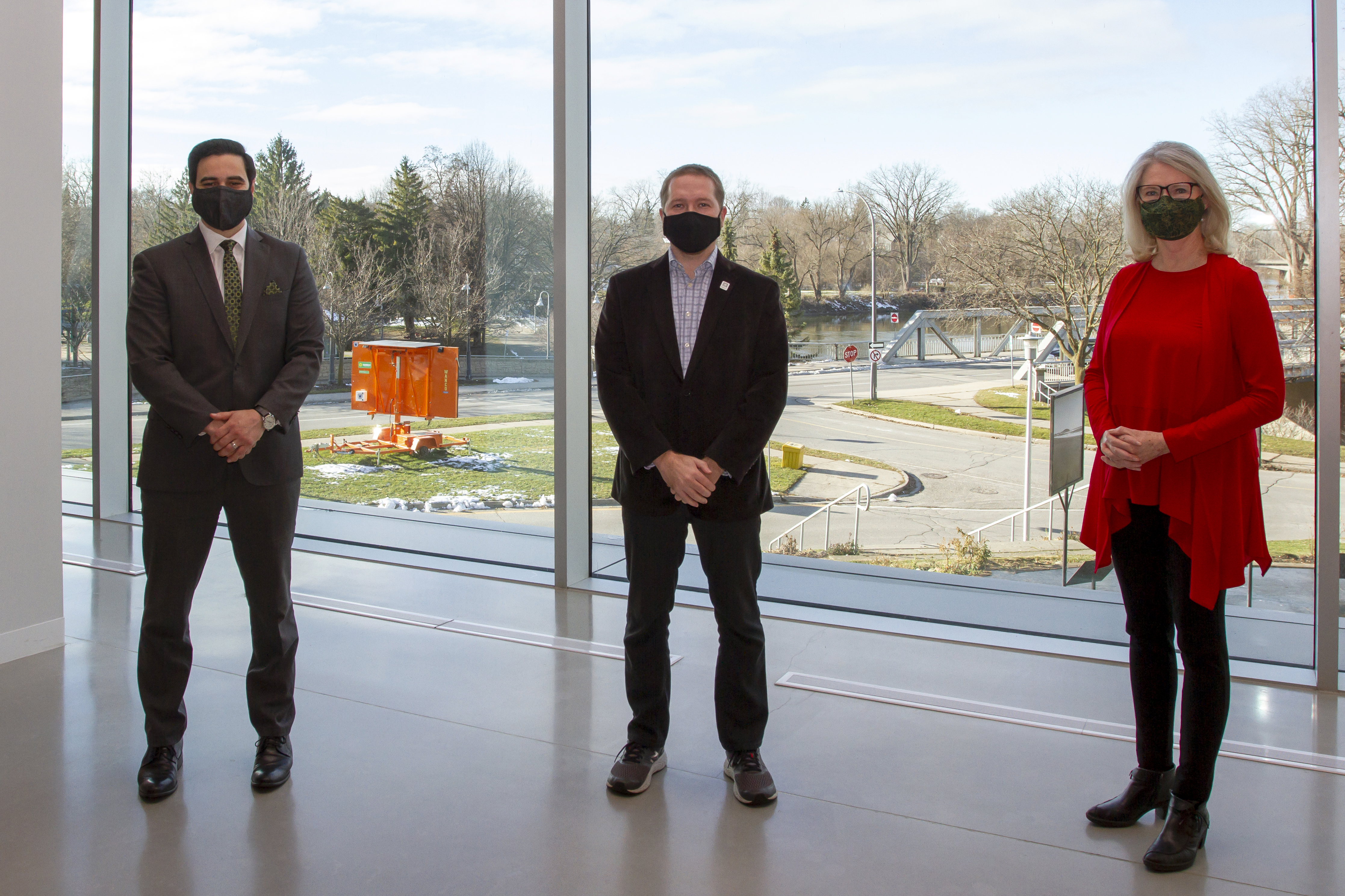 MP Peter Fragiskatos, Deputy Mayor Josh Morgan, and MP Kate Young stand together for a photo at Museum London downtown. 