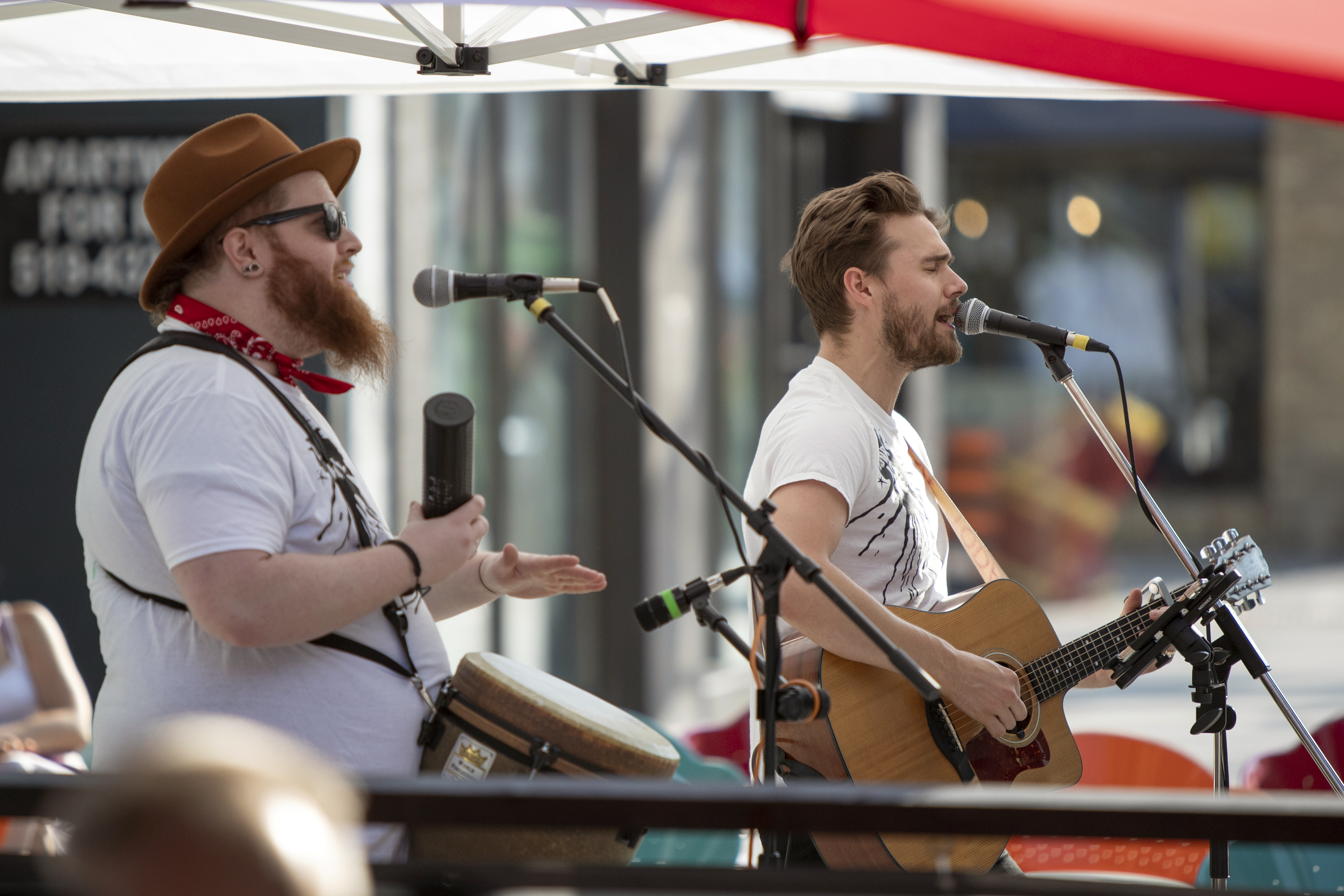 Musicians performing on Dundas Place’s sidewalk earlier this July. As businesses are reopening, additional programming is being planned for both weekdays and weekends each week. Some of this programming will now be extended into the street.