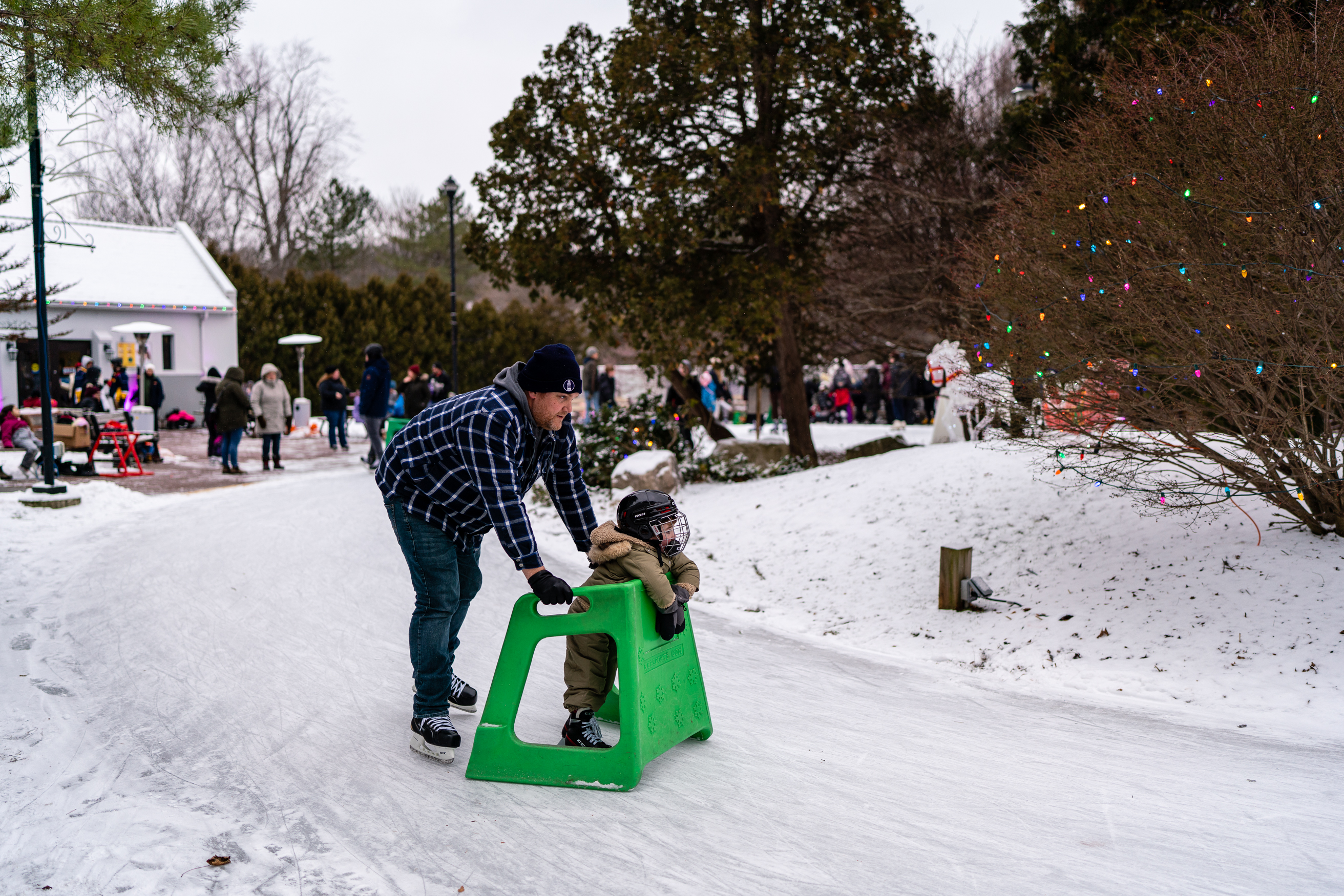 Father and child skating at Storybook Gardens' skate trail