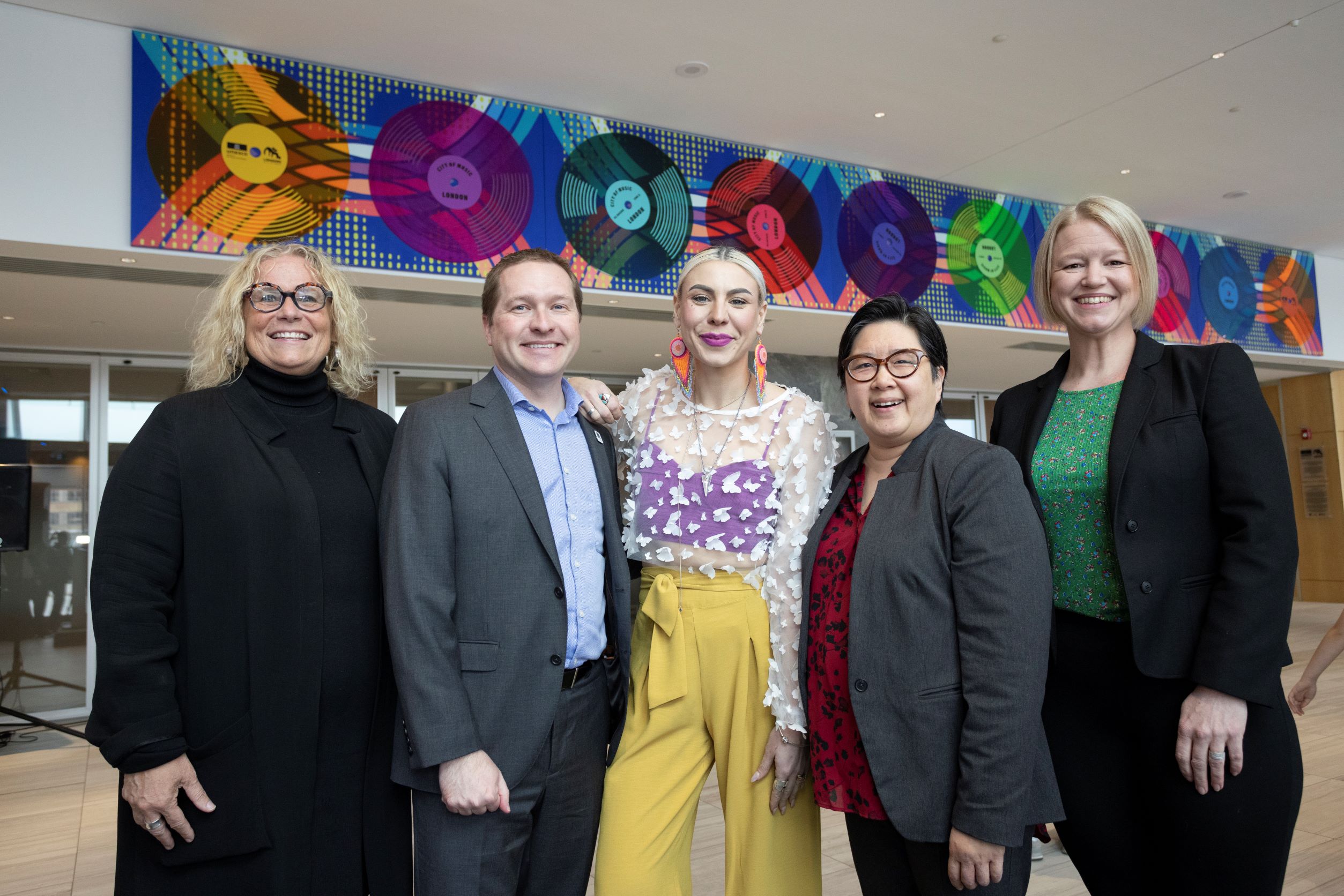 From left to right, Cheryl Smith, Deputy City Manager of Neighbourhood and Community-Wide Services at the City of London; Mayor Josh Morgan; local artist Tova Hasiwar; Janet Loo, Board of Directors’ Vice President at the London Arts Council; and Jennifer Diplock, Board of Directors’ Chair at RBC Place London celebrate the unveiling of the new mural. 