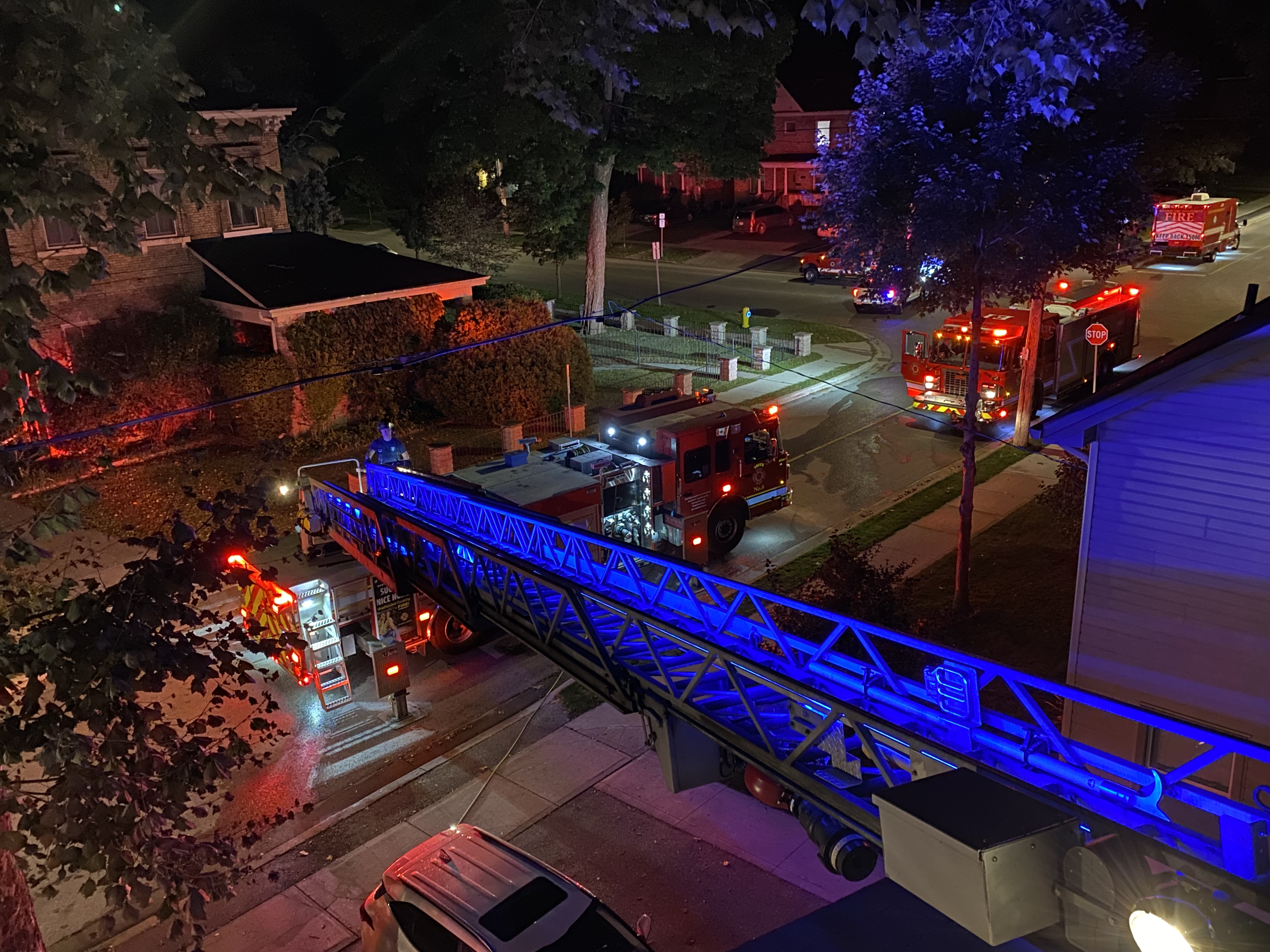 Fire truck at night with ladder extended