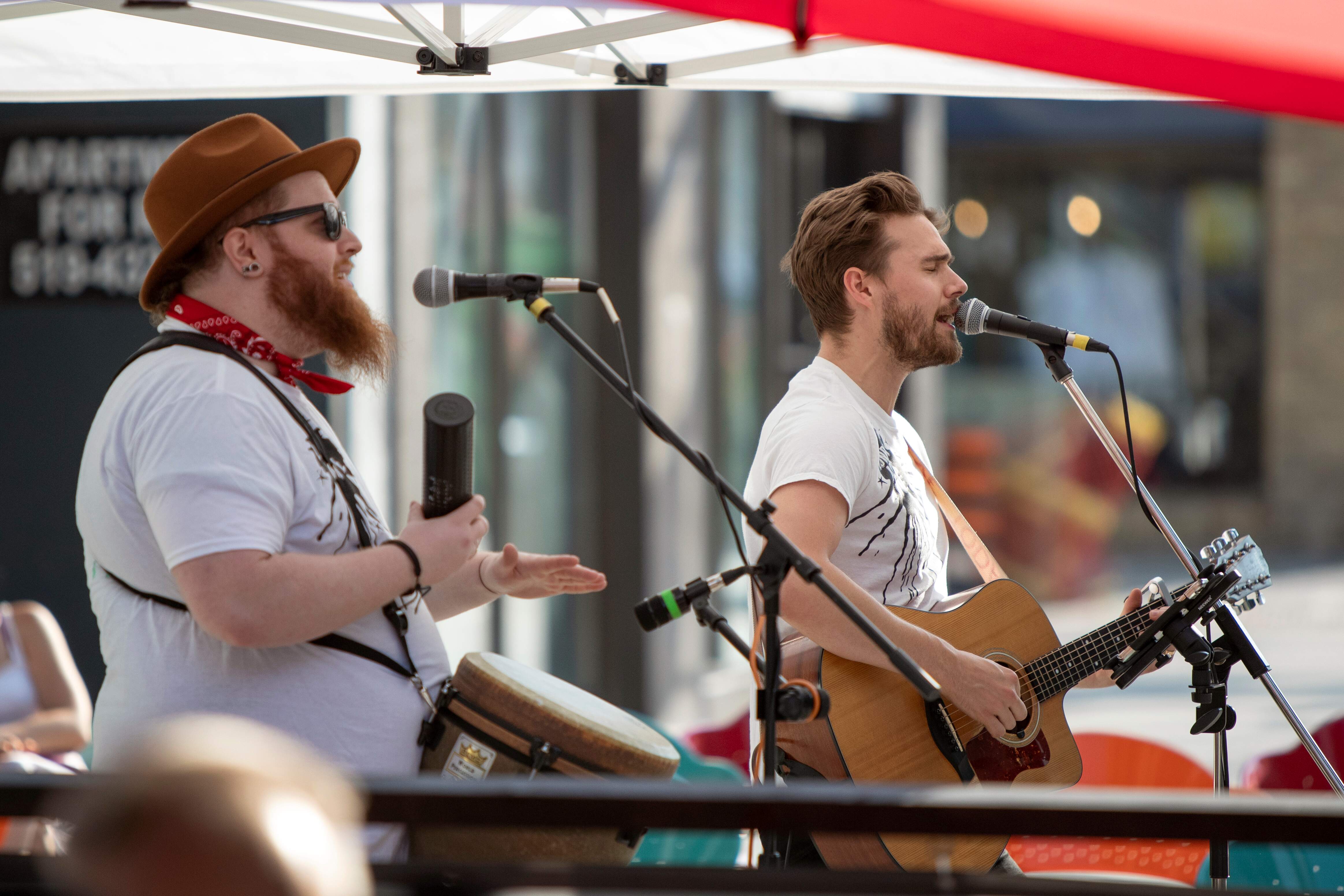 Musicians performing on Dundas Place’s sidewalk earlier this July. As businesses are reopening, additional programming is being planned for both weekdays and weekends each week. Some of this programming will now be extended into the street.