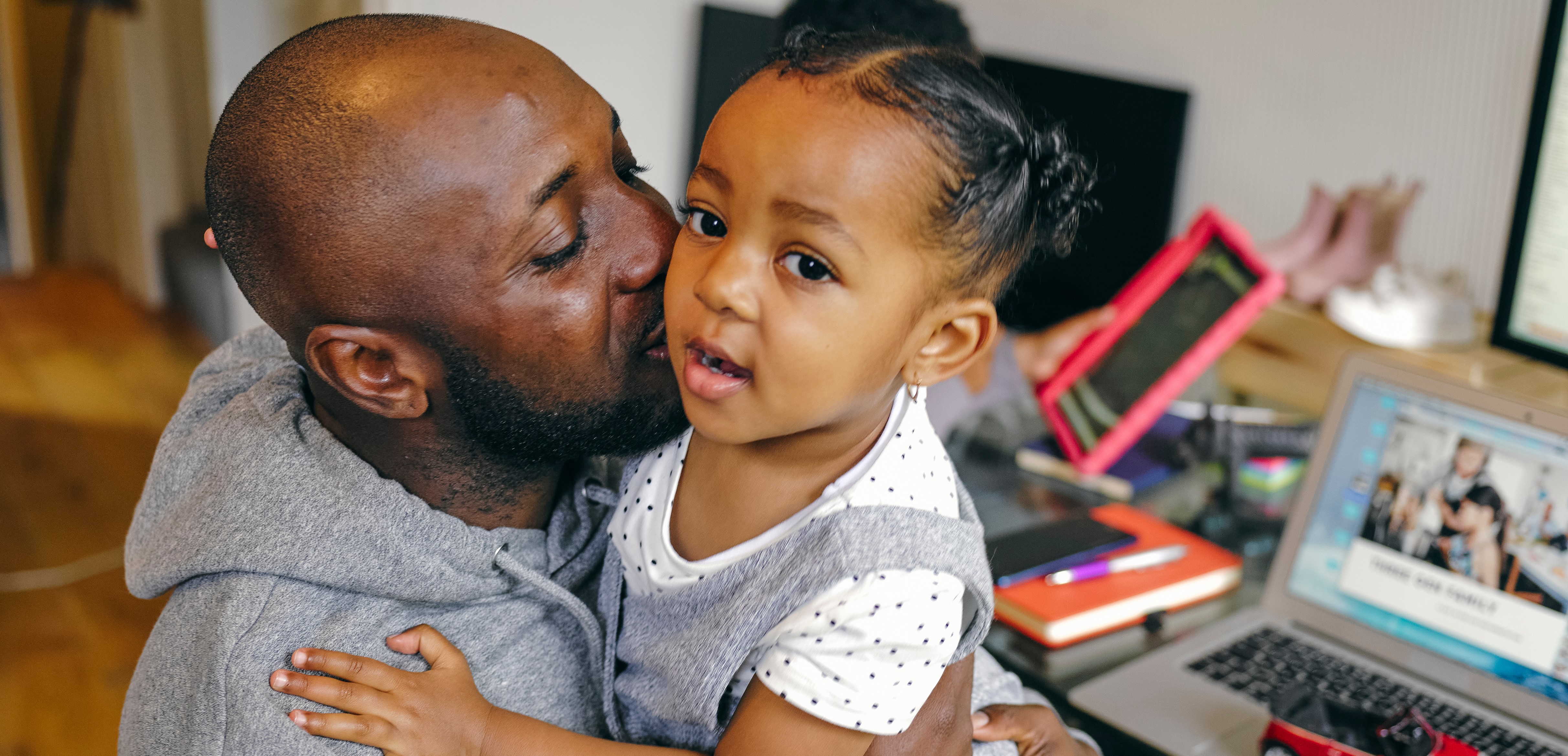 Father and daughter hugging at home