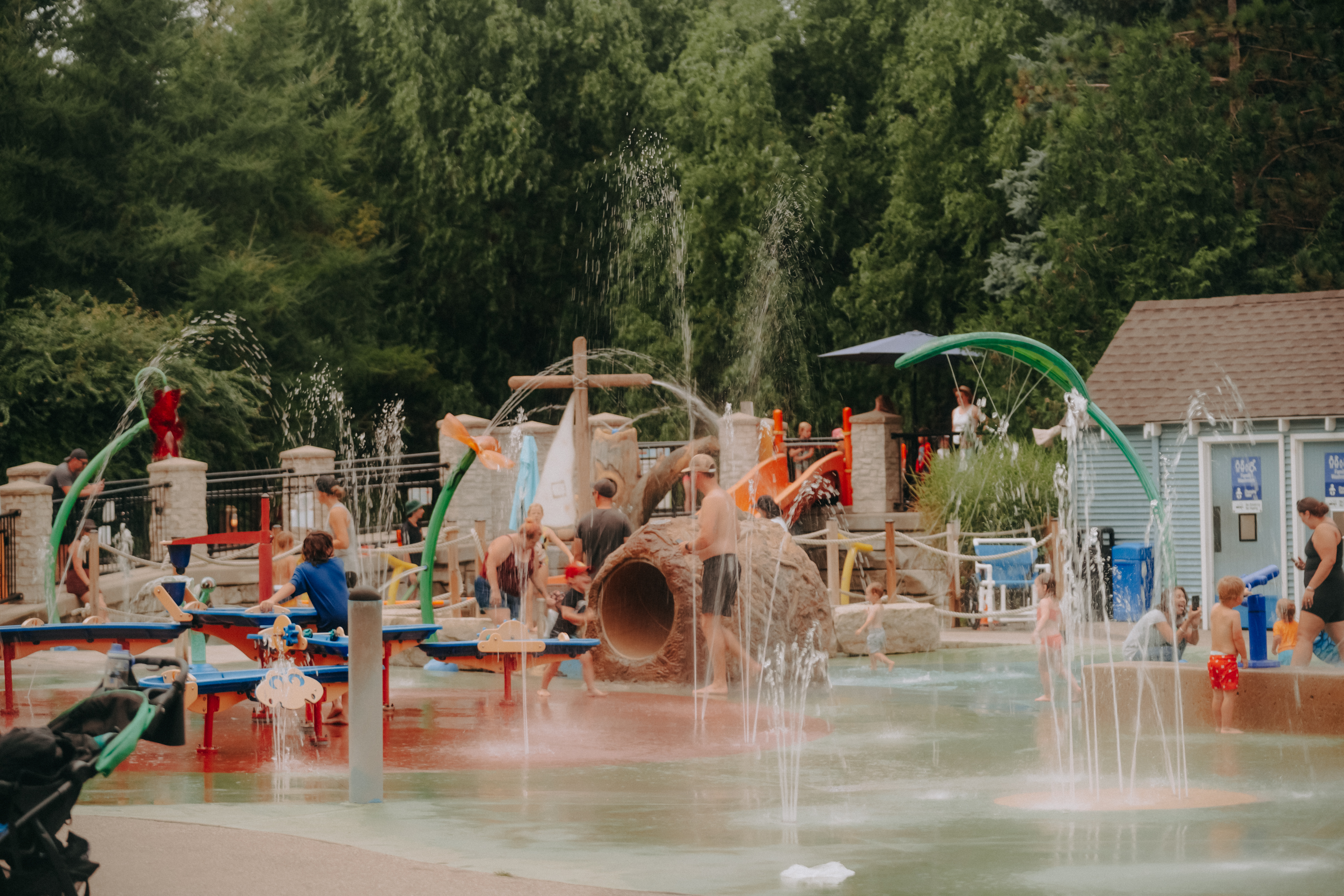 Children run through the spray pad at Storybook Gardens.