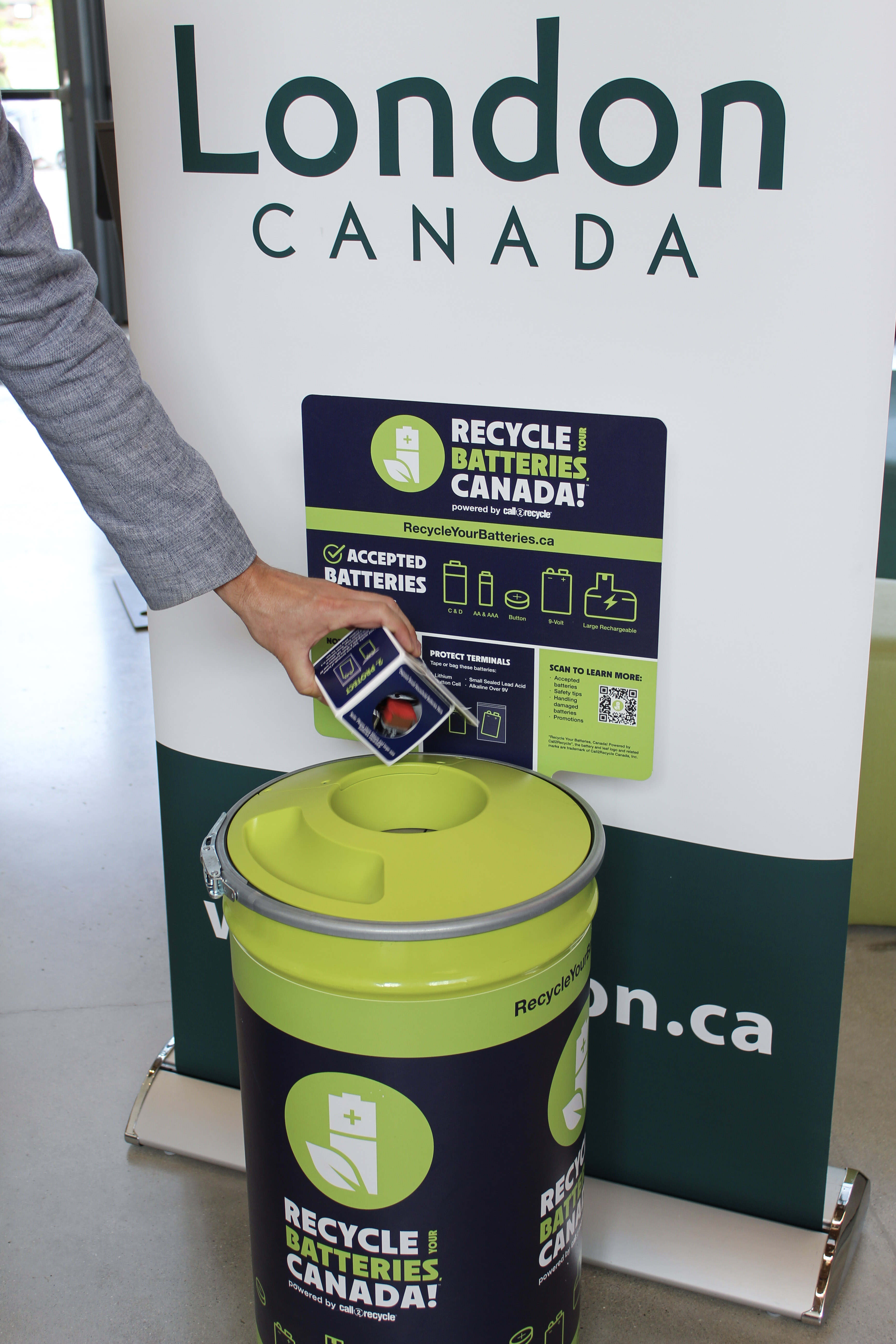 Photo of batteries going into Smart Container to be recycled.