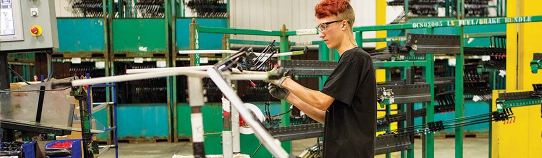 Person working on a machine in a factory