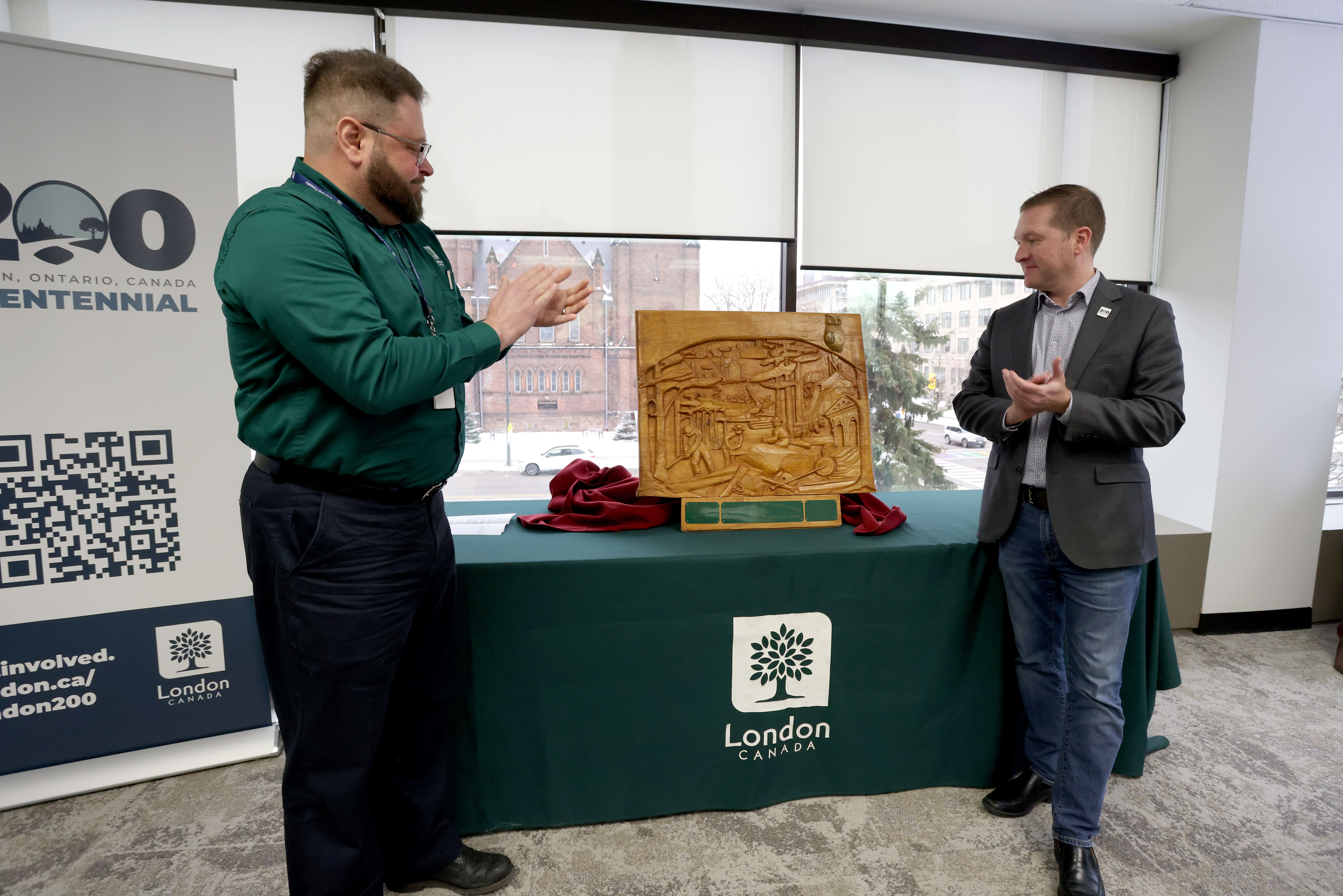 Above: Paul Yeoman, Director, Parks & Forestry (left) and Mayor Josh Morgan (right) unveil the commemorative Forest Capital of Canada plaque at London City Hall.