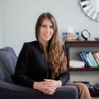 Woman sitting in a chair smiling