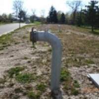 Example of drafting pipe outlet design. This section includes an image of a pipe coming from the ground with a 90 degree elbow attached to the end.  