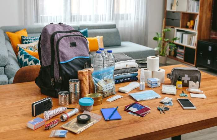 Backpack with several emergency kit items.