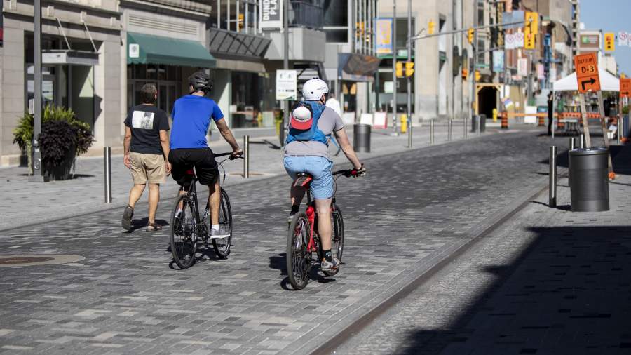 Dundas Place with two cyclists