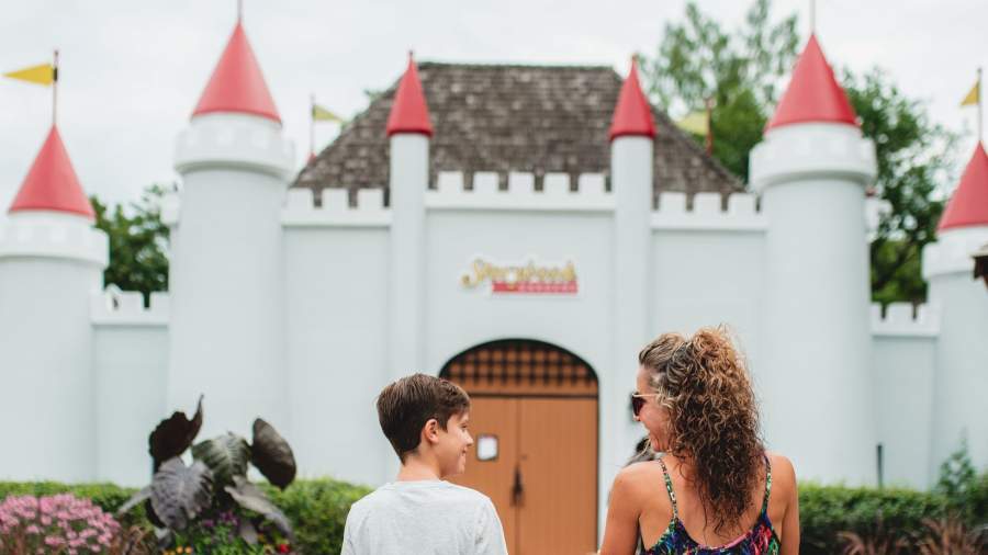 Mother and son entering the Storybook Gardens castle